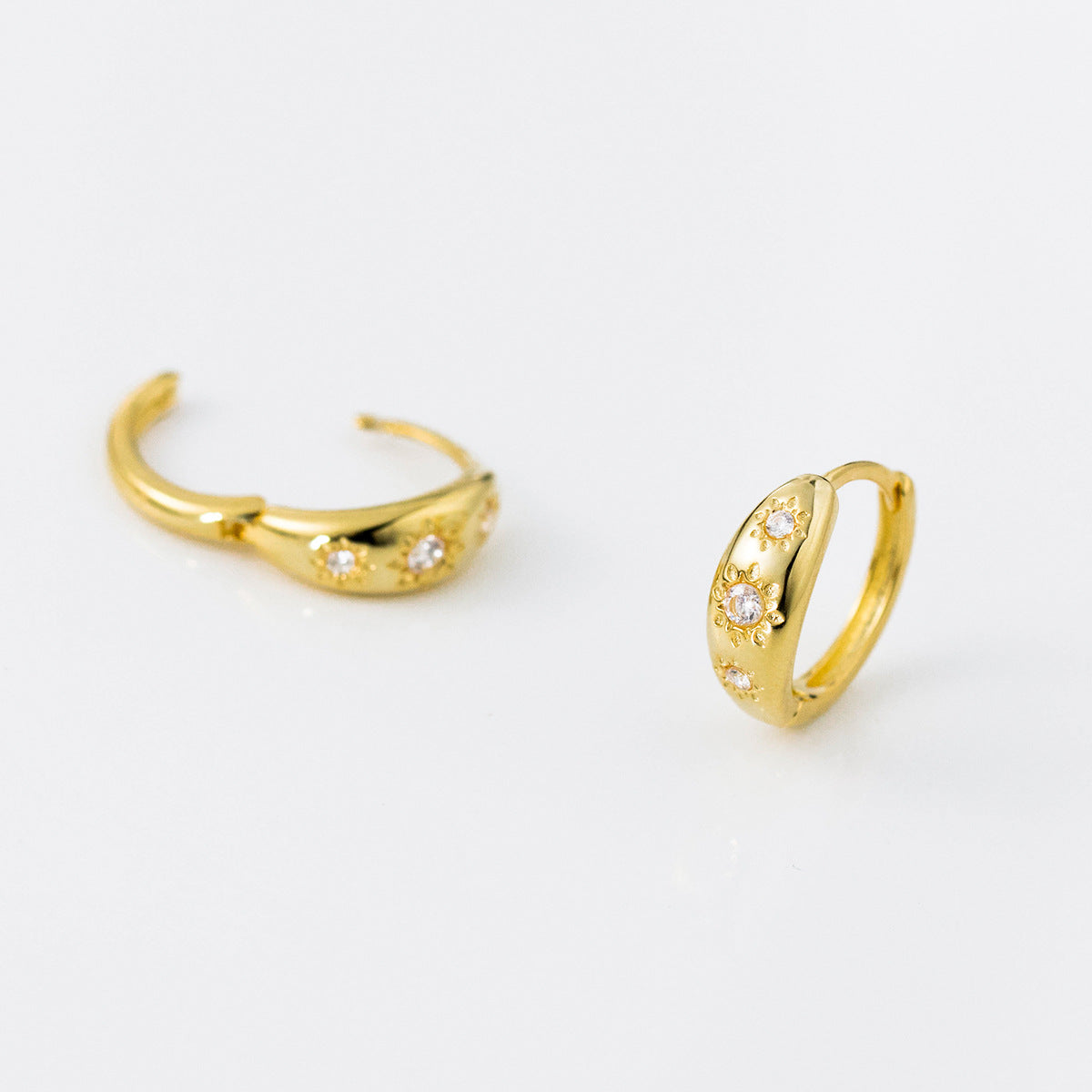 Sterling Silver Huggie Hoop Earrings with a Curved Clicker Design