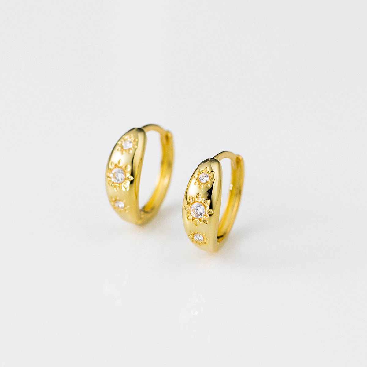 Sterling Silver Huggie Hoop Earrings with a Curved Clicker Design